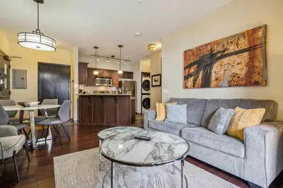 a living room with a couch and a table at Cozy One Bedroom Condo with Indoor Pool and HotTub in Canmore
