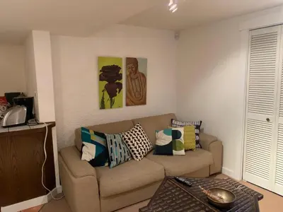 a living room with a couch and a table at fabulous beach side apartment in Vancouver