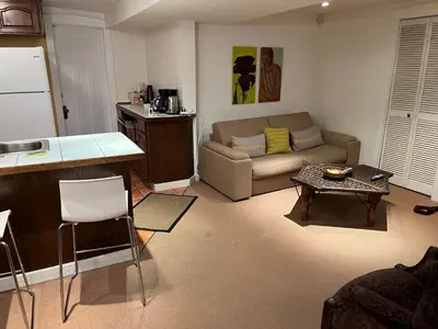 a living room with a couch and a table at fabulous beach side apartment in Vancouver