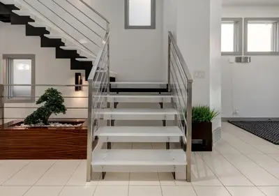 a staircase in a home with white floors and white walls at Newly Renovated Vacation Home w/ Hot Tub & Garage in Calgary