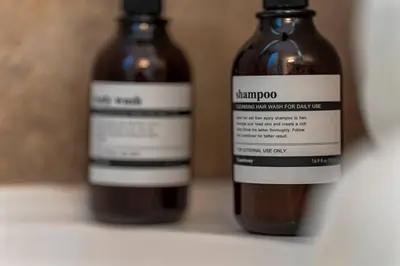 two bottles of liquid sitting next to each other at Elegant Boho Retreat - 8 min to WEM in Edmonton