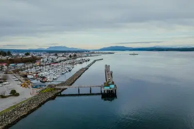 an aerial view of a marina with boats in the water at By the Sea in Campbell River