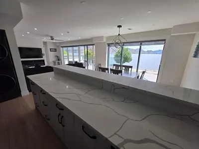 a large kitchen with a large white counter top at Premium Deluxe PeachView Suites 3BR in Peachland