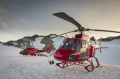 two red helicopters are parked in the snow at Bear Lodge, Whistler Village - Spectacular Location on Village Stroll, Designer Remodel in Whistler
