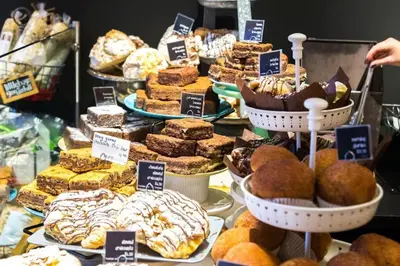 a display of different types of pastries in a bakery at Bear Lodge, Whistler Village - Spectacular Location on Village Stroll, Designer Remodel in Whistler