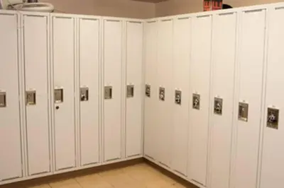 a row of white lockers with pictures on them at Bear Lodge, Whistler Village - Spectacular Location on Village Stroll, Designer Remodel in Whistler