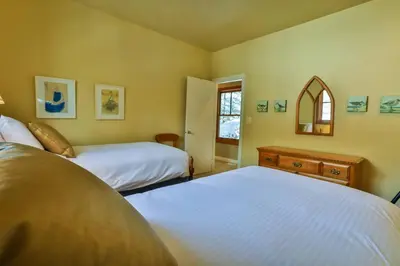 a bedroom with two beds and a window at 4 Mt Brewer by StayIn in Panorama