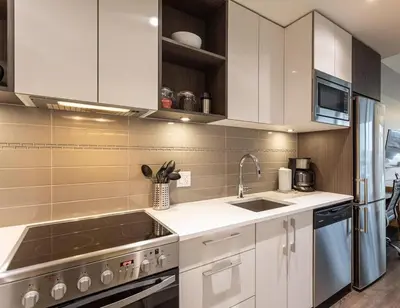 a kitchen with white cabinets and a sink at Be The Perfect Cityzen In Cityzen in Victoria