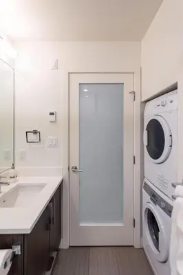 a white bathroom with a sink and a washing machine at Be The Perfect Cityzen In Cityzen in Victoria