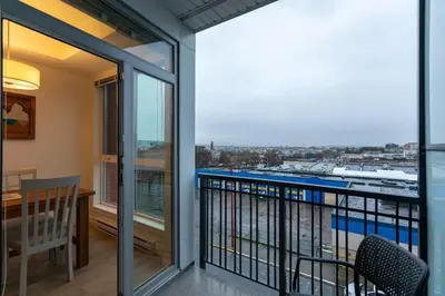 a balcony with a table and chairs and a view at Be The Perfect Cityzen In Cityzen in Victoria