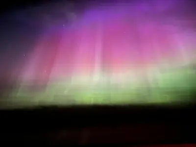 an image of the northern lights in the sky at Avola Mountain Lodge in Avola