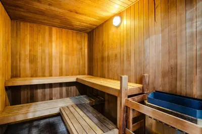 a wooden sauna with a wooden bench in it at Studio in Alpenglow Lodge, Private Balcony with Mountain Views, Gym, Epic Location in Whistler