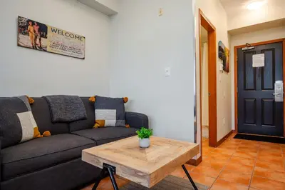 a living room with a couch and a coffee table at Studio in Alpenglow Lodge, Private Balcony with Mountain Views, Gym, Epic Location in Whistler