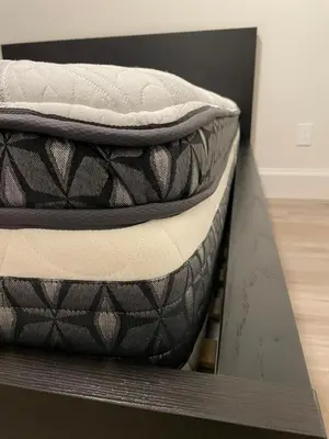 a mattress sitting on top of a box at Home In Vancouver in Richmond