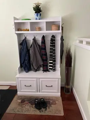 a white hutch with ties on it in a room at Marine Drive Station Entire House in Vancouver
