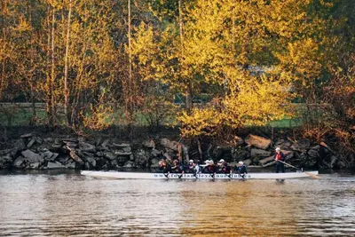 a group of people in a boat on the water at Fort Langley Homestead in Maple Ridge District Municipality