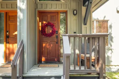 a front door of a house with a wreath on it at 2BR in Blackcomb Greens, Wood Fireplace, Hot Tub Access, Mountain Views, Free Ski Shuttle, Parking in Whistler