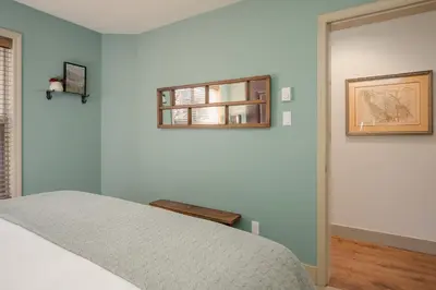 a bedroom with a bed and a window at 2BR in Blackcomb Greens, Wood Fireplace, Hot Tub Access, Mountain Views, Free Ski Shuttle, Parking in Whistler