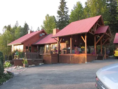 a house with a pavilion with a car parked in front at beard's creek bed and breakfast in Parson