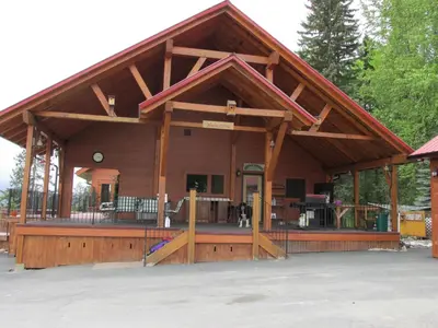 a large wooden pavilion with a porch at beard's creek bed and breakfast in Parson