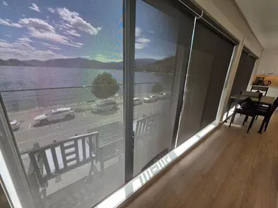 a view of a balcony with a view of the water at PeachView Deluxe Suites 301 in Peachland