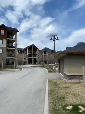 an empty street in front of a apartment complex at Lake Windermere Pointe by StayIn in Invermere