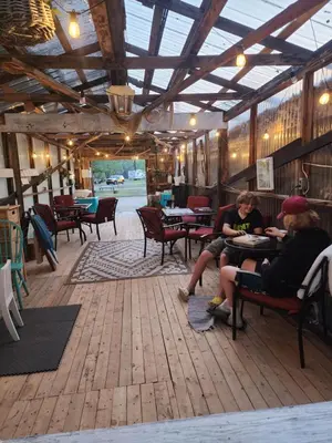a group of people sitting at tables in a restaurant at D6 Sahara Sunset- King Suite Very Private in Drumheller