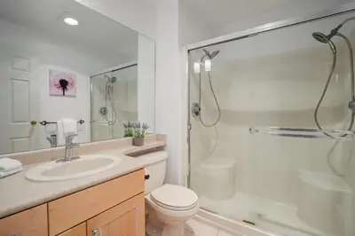 a bathroom with a toilet and a shower and a sink at 4BR in Blueberry Hill Estates, Mountain Views, Large Family Home, Wood Fireplace, Balcony in Whistler