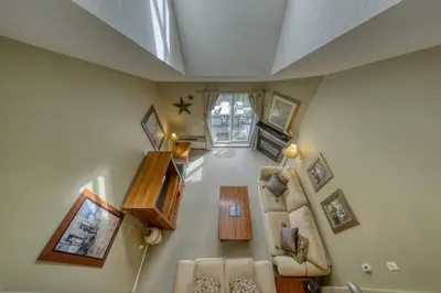 an overhead view of a living room with furniture at The Peaks 3 Bedroom Mountain View Condo in Radium Hot Springs