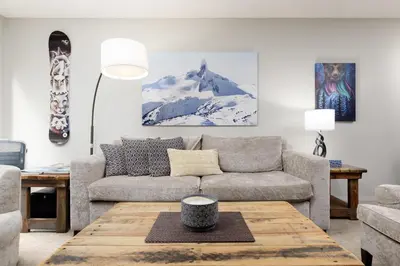 a living room with a couch and a table at Spacious 3BR Condo in Whistler in Whistler