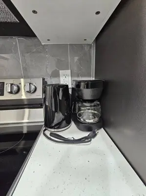 a kitchen with a counter top with a blender at Parkside Basement Suite in Edmonton