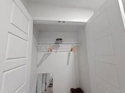 a closet with white walls and a white door at Parkside Basement Suite in Edmonton