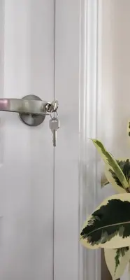 a door with a door knob and a plant at Cozy Comfort rooms in Nanaimo in Nanaimo