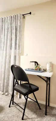 a black chair sitting in front of a desk at Cozy Comfort rooms in Nanaimo in Nanaimo