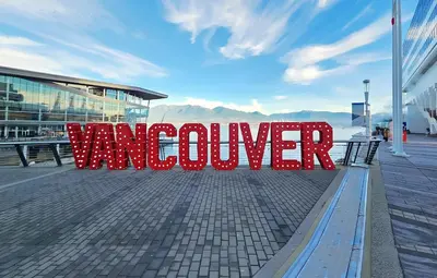 a red sign that says warmer sitting on a bench at New Bright Modern Guest Suite in Vancouver in Burnaby