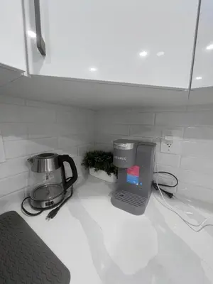 a kitchen counter with a coffee maker and a blender at Adorable Private Suite in Seton SE, Calgary in Calgary