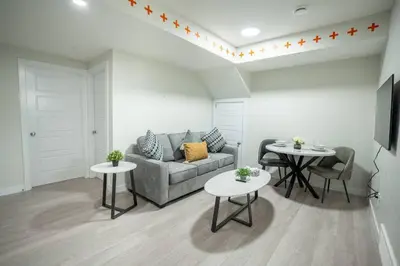 a living room with a couch and two tables at Warm getaway Perfect for 4 in Edmonton