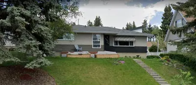 a house with a yard with a lawn sidx sidx sidx sidx at My Home in Calgary