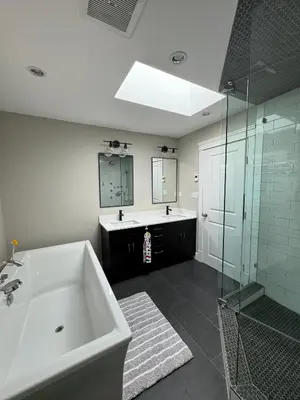 a bathroom with a tub and a sink and a shower at Cozy home in Brookswood in Langley