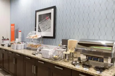 a kitchen with a counter with food on it at Hampton Inn by Hilton Lloydminster in Lloydminster