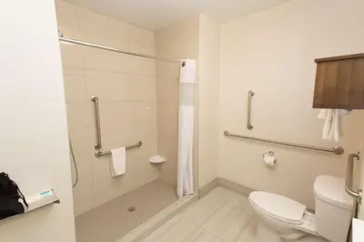 a bathroom with a toilet and a shower at Hampton Inn by Hilton Lloydminster in Lloydminster