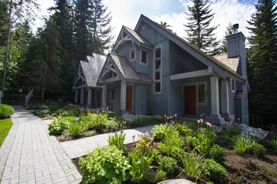 a house with a garden in front of it at #24 Treeline in Whistler