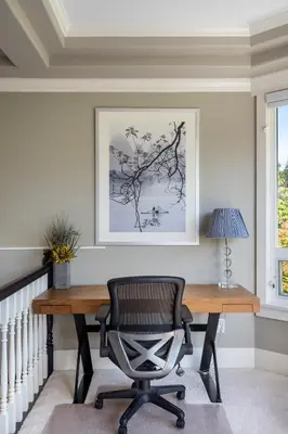 a desk with a chair and a picture on the wall at Luxurious Multi-Family Home in Vancouver West, 10 Mins Downtown in Vancouver