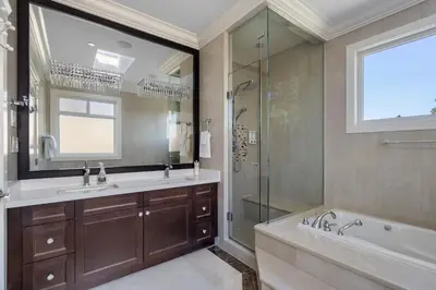 a bathroom with a tub and a sink and a shower at Luxurious Multi-Family Home in Vancouver West, 10 Mins Downtown in Vancouver