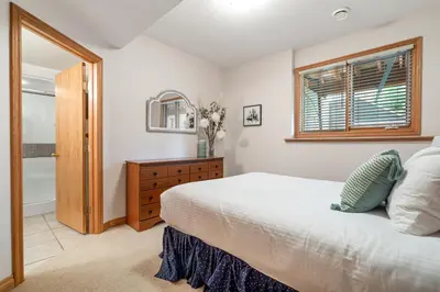a bedroom with a bed and a window at Chateau Lawrence, Pool Table, Kids' Gaming Room in Fairmont Hot Springs