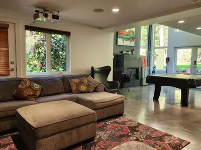 a living room with a couch and a table at 2BD Guest Suite Sleeps 6 Near Downtown & Beach in West Vancouver