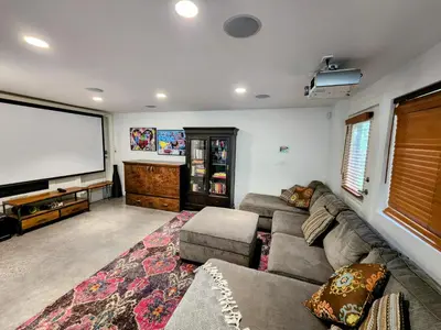 a living room with a couch and a flat screen tv at 2BD Guest Suite Sleeps 6 Near Downtown & Beach in West Vancouver