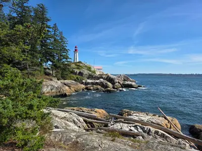 a lighthouse on the shore of a body of water at 2BD Guest Suite Sleeps 6 Near Downtown & Beach in West Vancouver