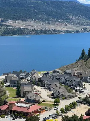 an aerial view of a town next to a lake at La Casa Lakeside Resort - Amazing Panoramic View Lakeside House with Pools, Hot Tubs & More! in Kelowna