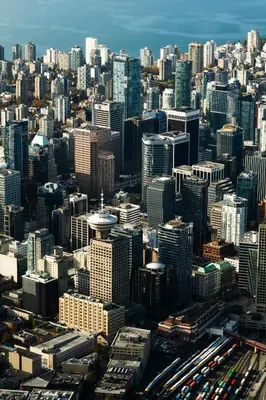 an aerial view of a large city with buildings at The Altitude with Mountain & City Views, Pool & Hot Tub in Vancouver